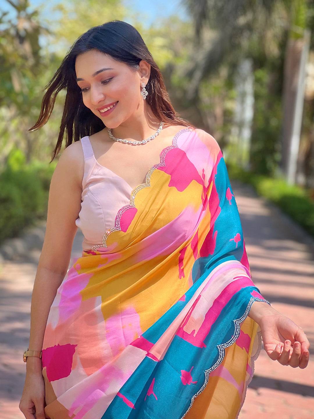 Vibrant multi satin georgette floral print saree outdoors