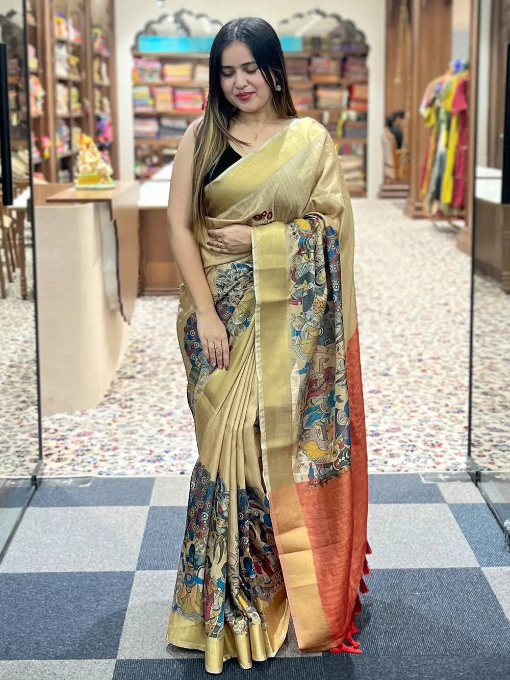 Traditional Kalamkari saree displayed in a boutique