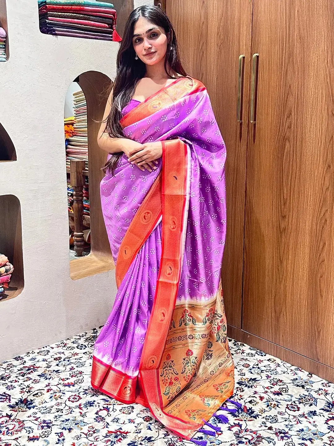 Model in purple Bandhani saree with Paithani border, standing