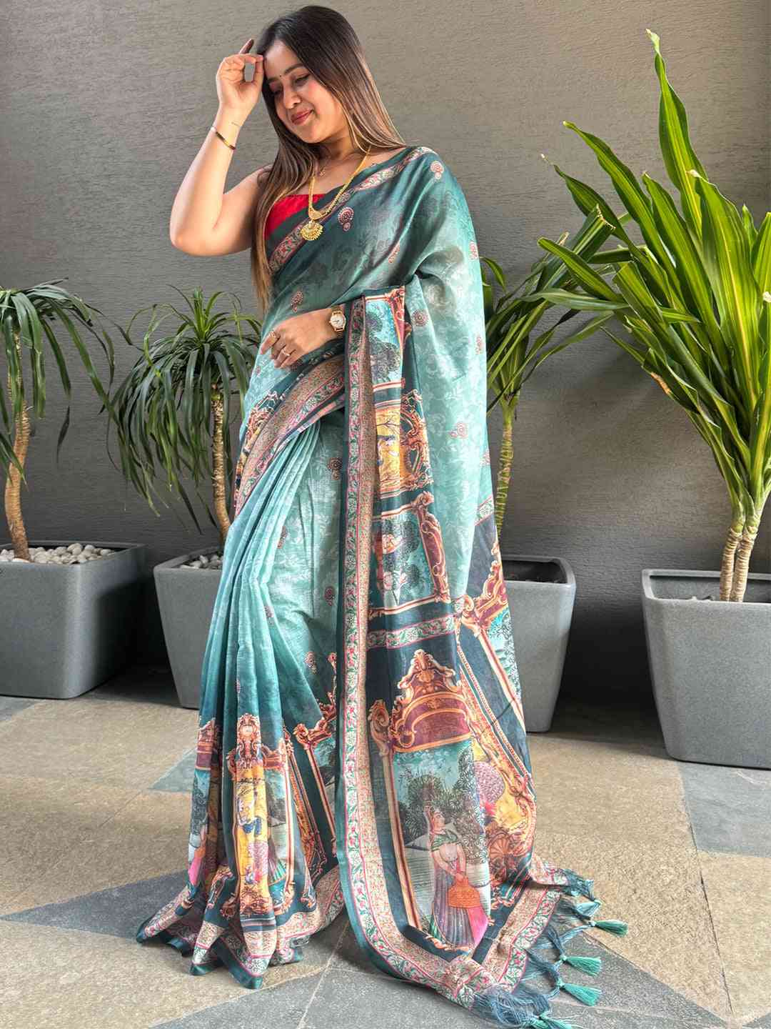 Stylish turquoise saree featuring digital print and rich border