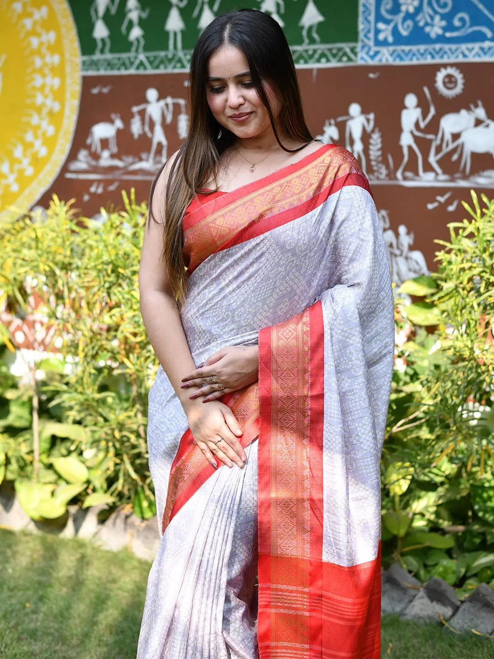 Soft silk Bandhej saree featuring a vibrant red border