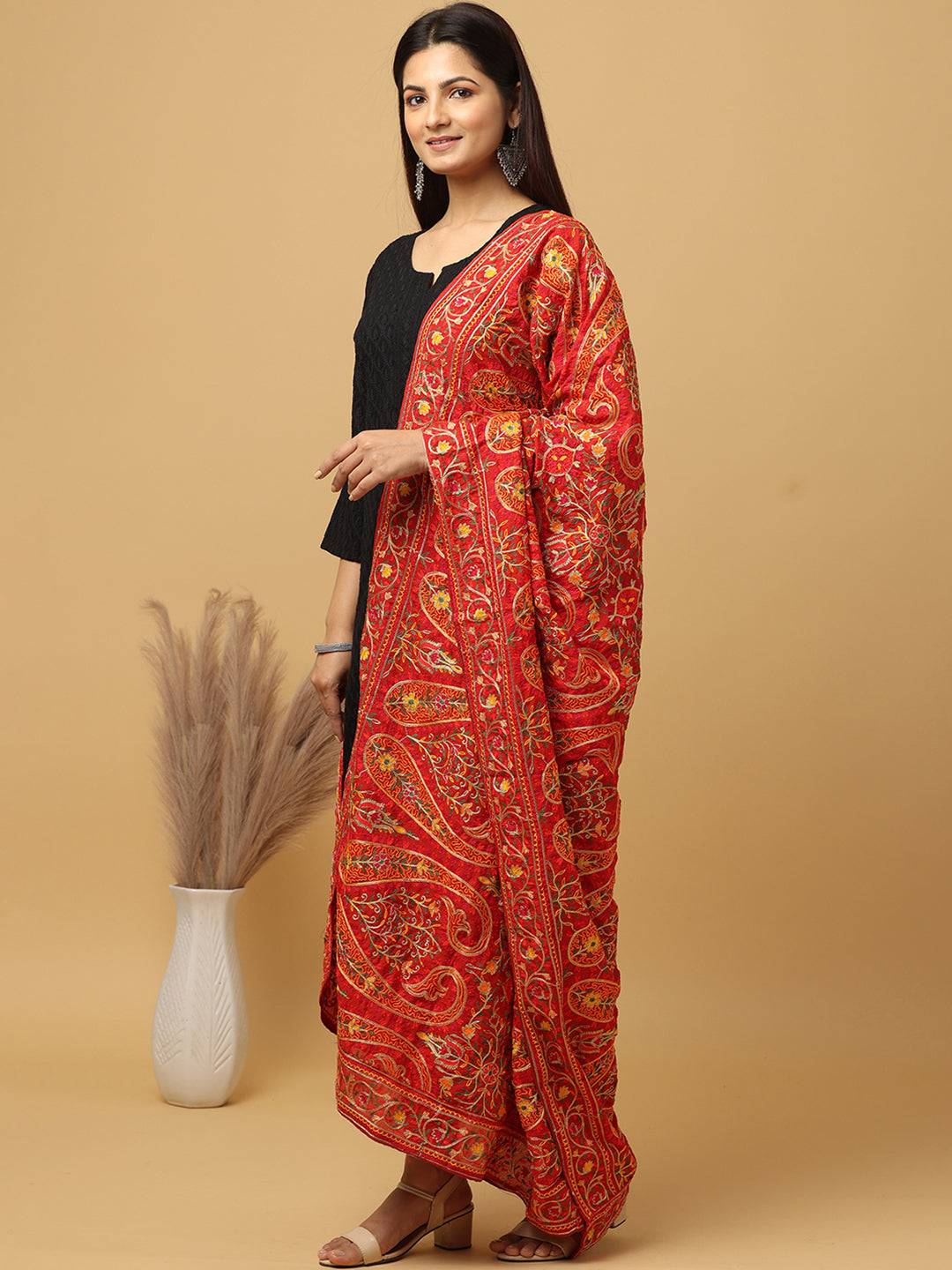 Model wearing red embroidered pashmina dupatta