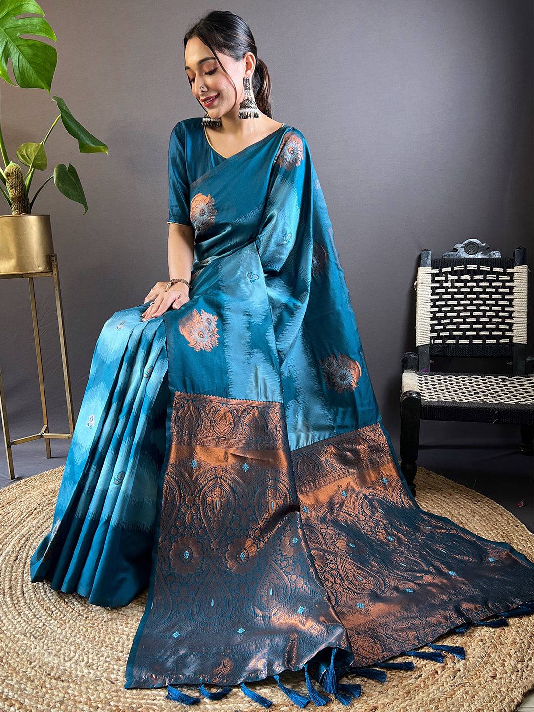 Seated model showcasing blue Tussar silk Ikkat saree