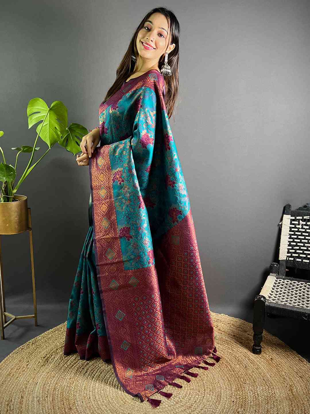 Model showcasing Teal Soft Silk Butta Weaving Saree with tassels
