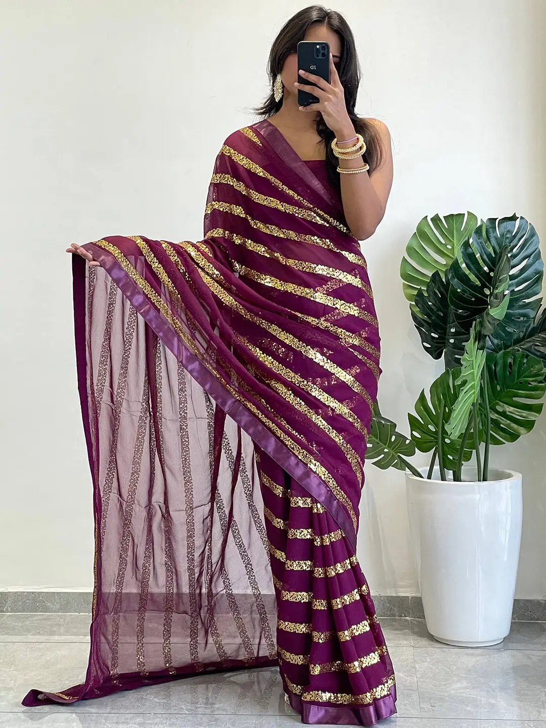 Georgette saree with striped sequins work and solid border