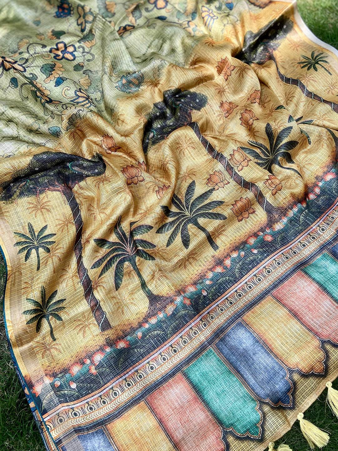 Detailed view of floral and palm motifs on light green Kota Doriya saree