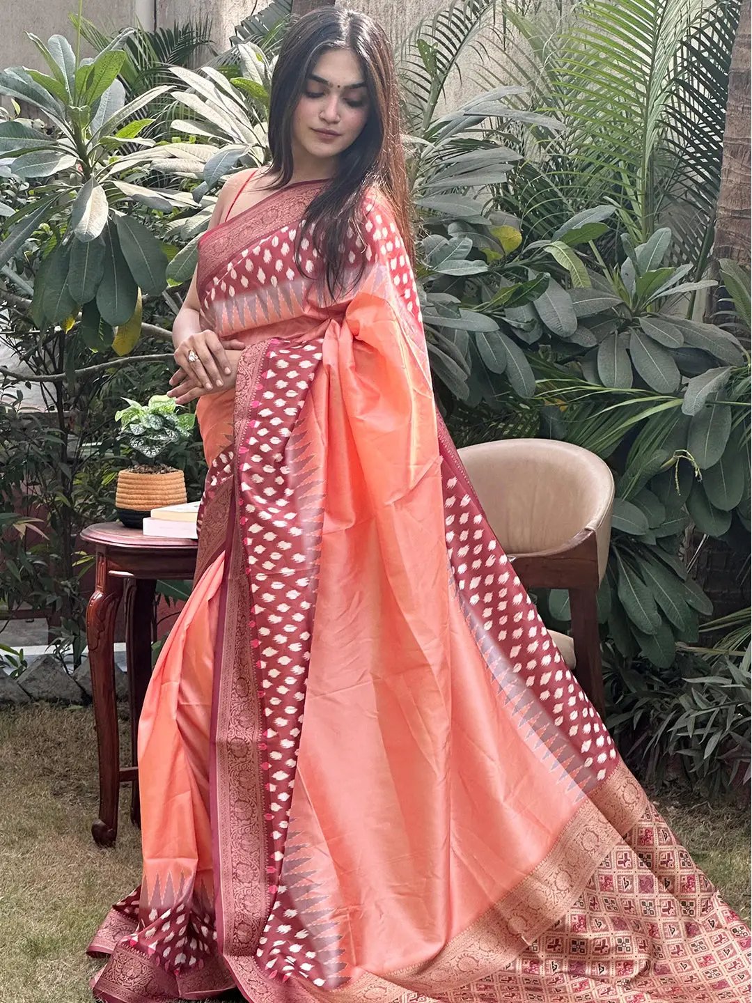 Peach Banarasi soft silk saree showcasing Patola pallu details