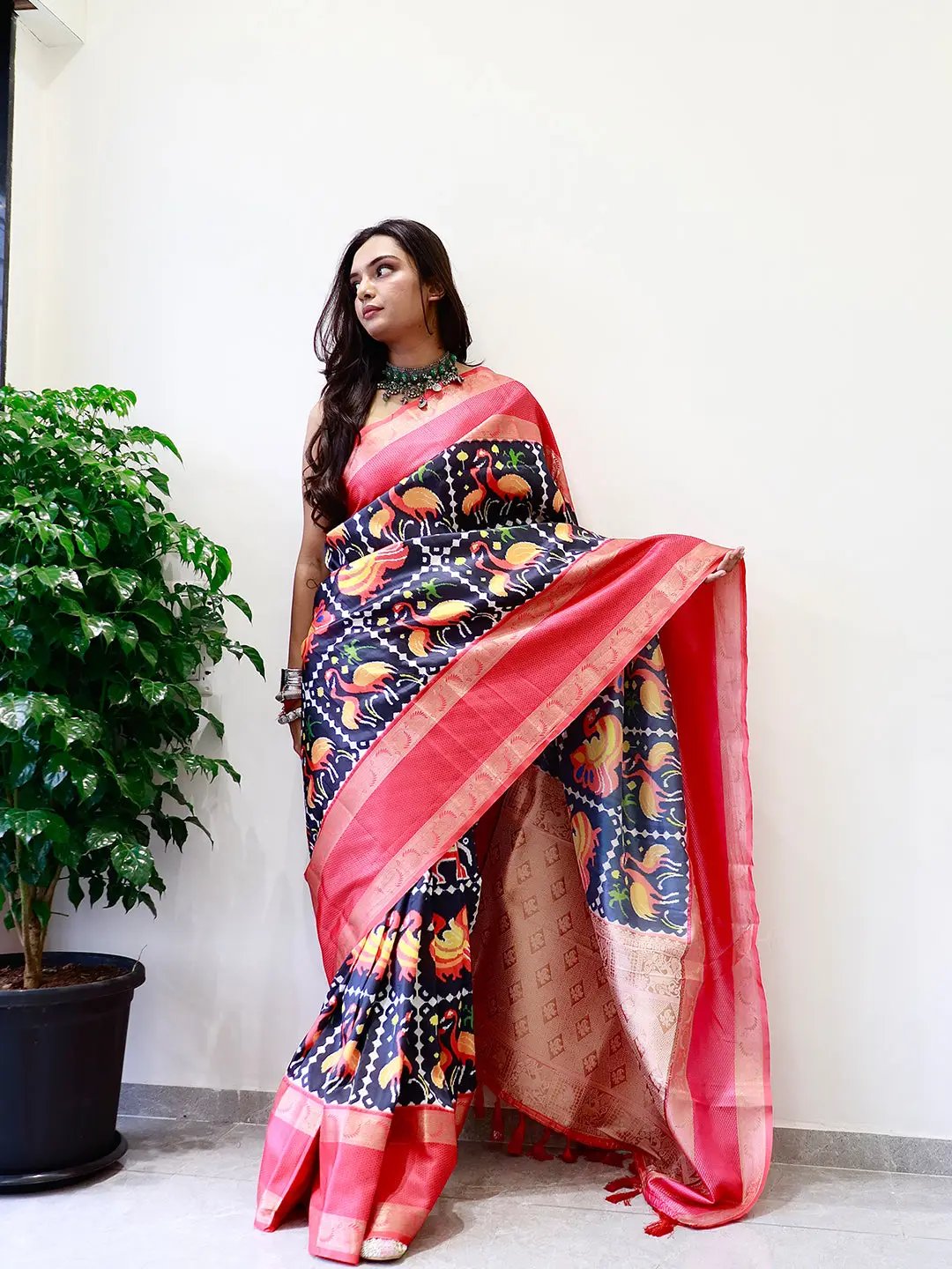 Elegant soft silk saree with vibrant Pochampally print and Gadwal border.