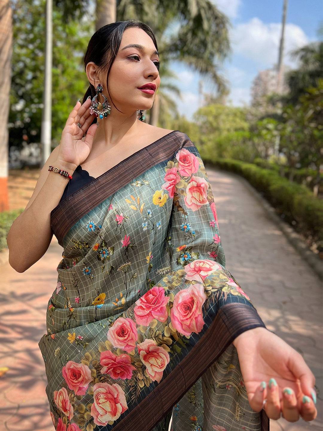 Teal silk saree with copper zari and floral print