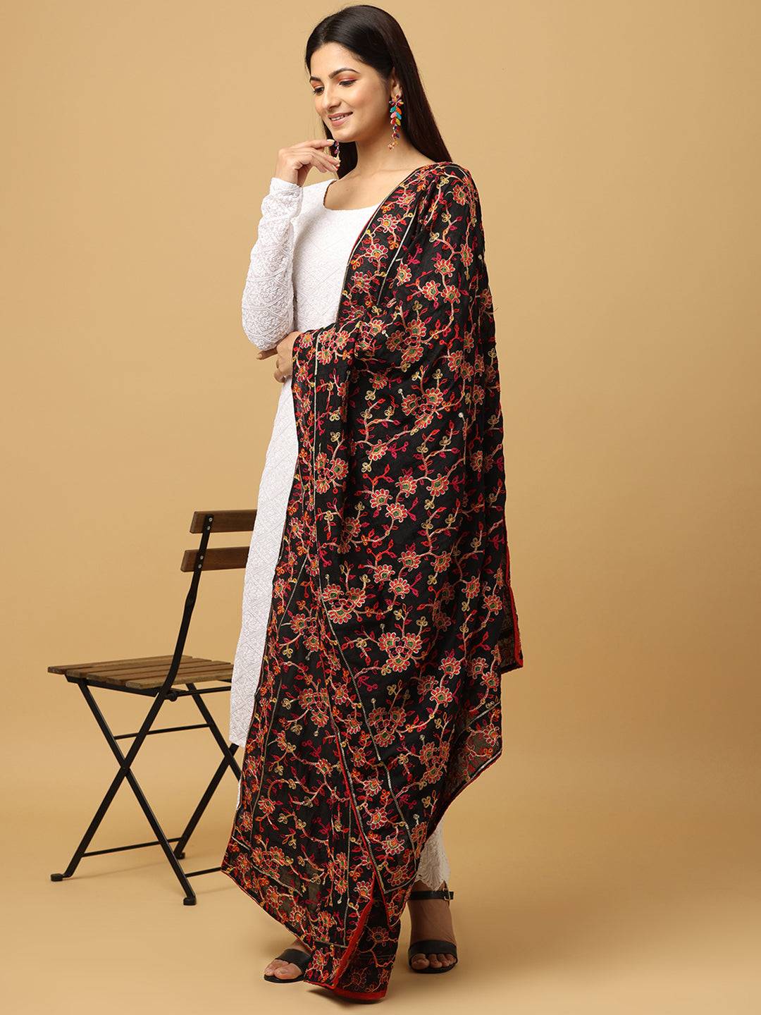 Side view of black chiffon dupatta with colorful thread motifs.