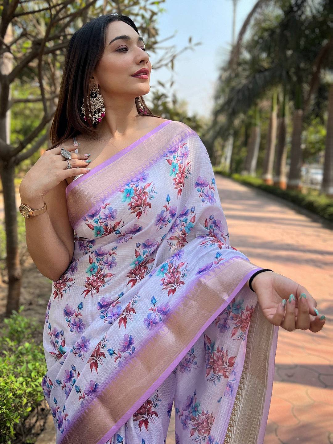 Model wearing light purple floral printed Kota saree