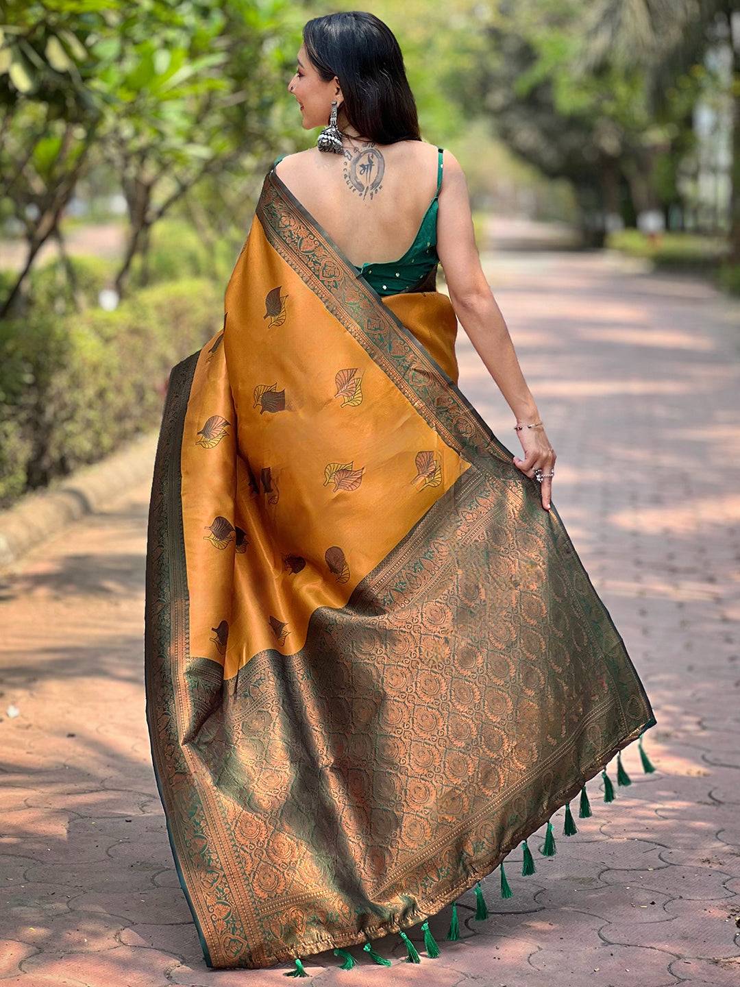 Back view of butterscotch Kanjivaram saree with gold zari details