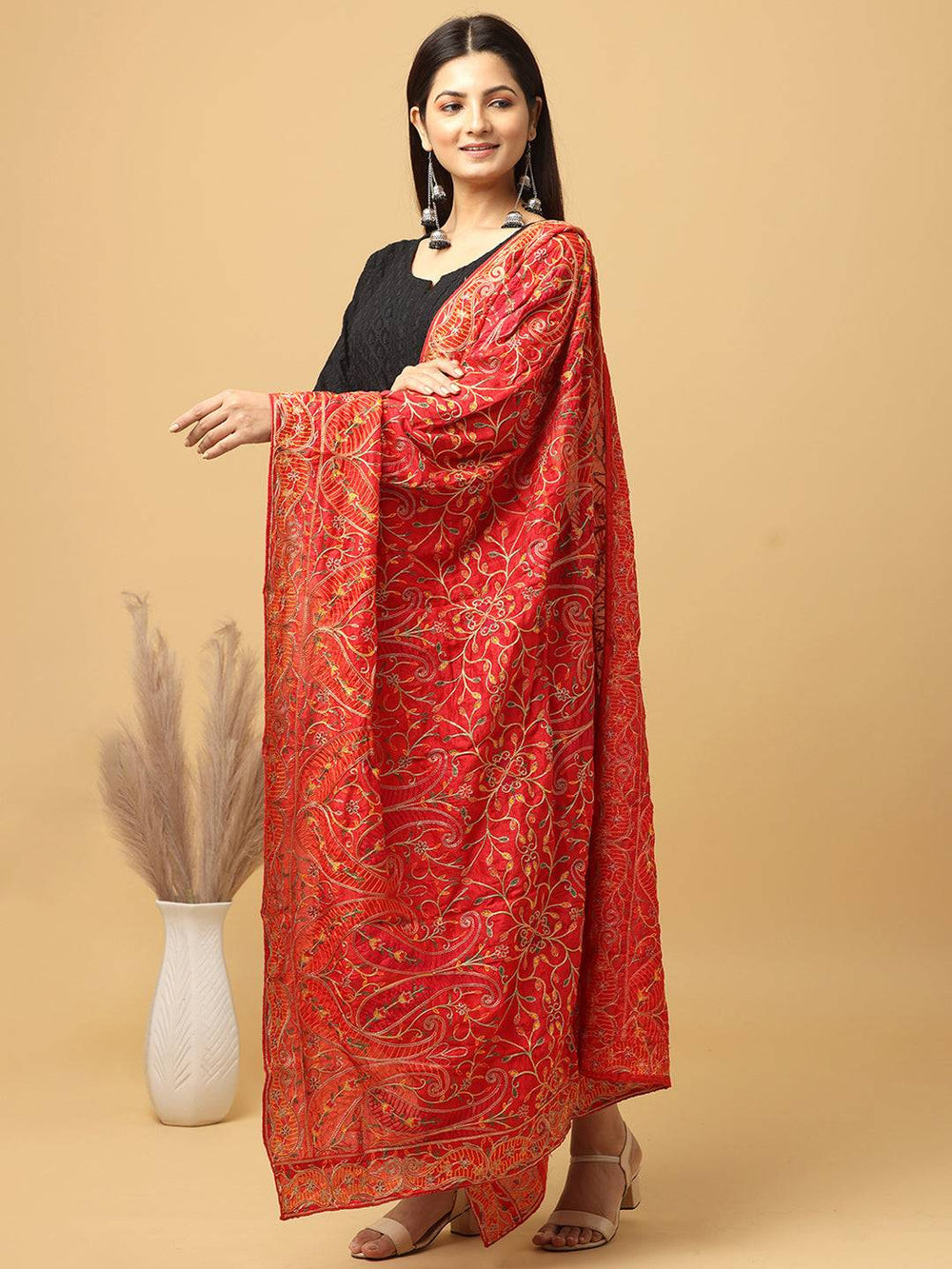 Side view of red pashmina threadwork dupatta on model