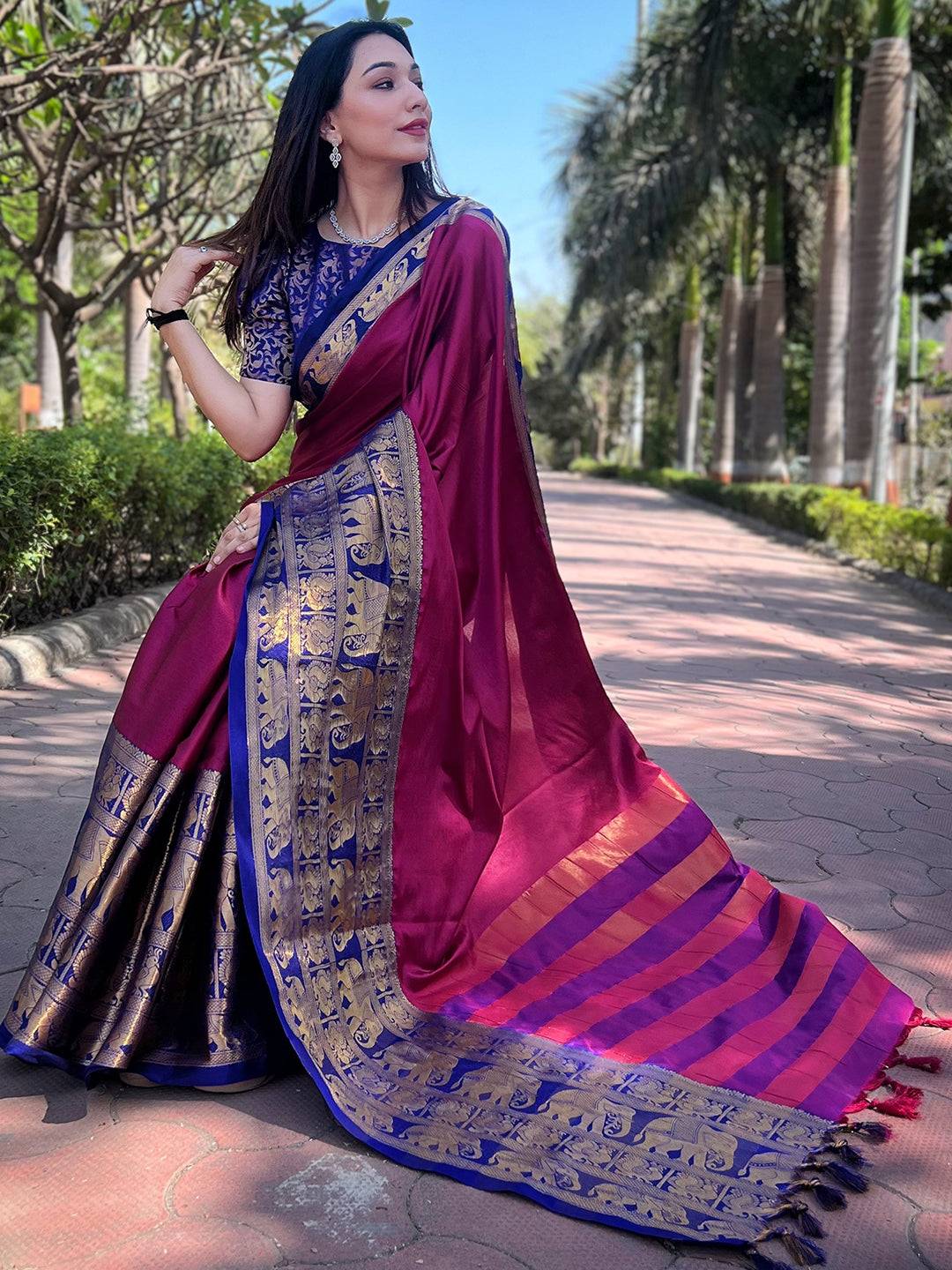 Luxurious maroon saree with gold and blue accents