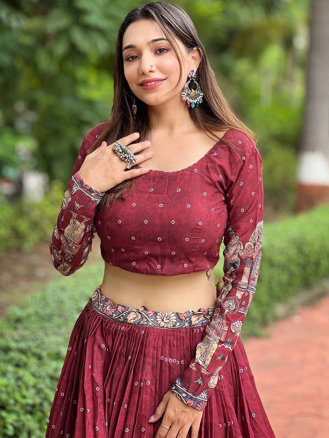Model wearing deep maroon Kalamkari lehenga set