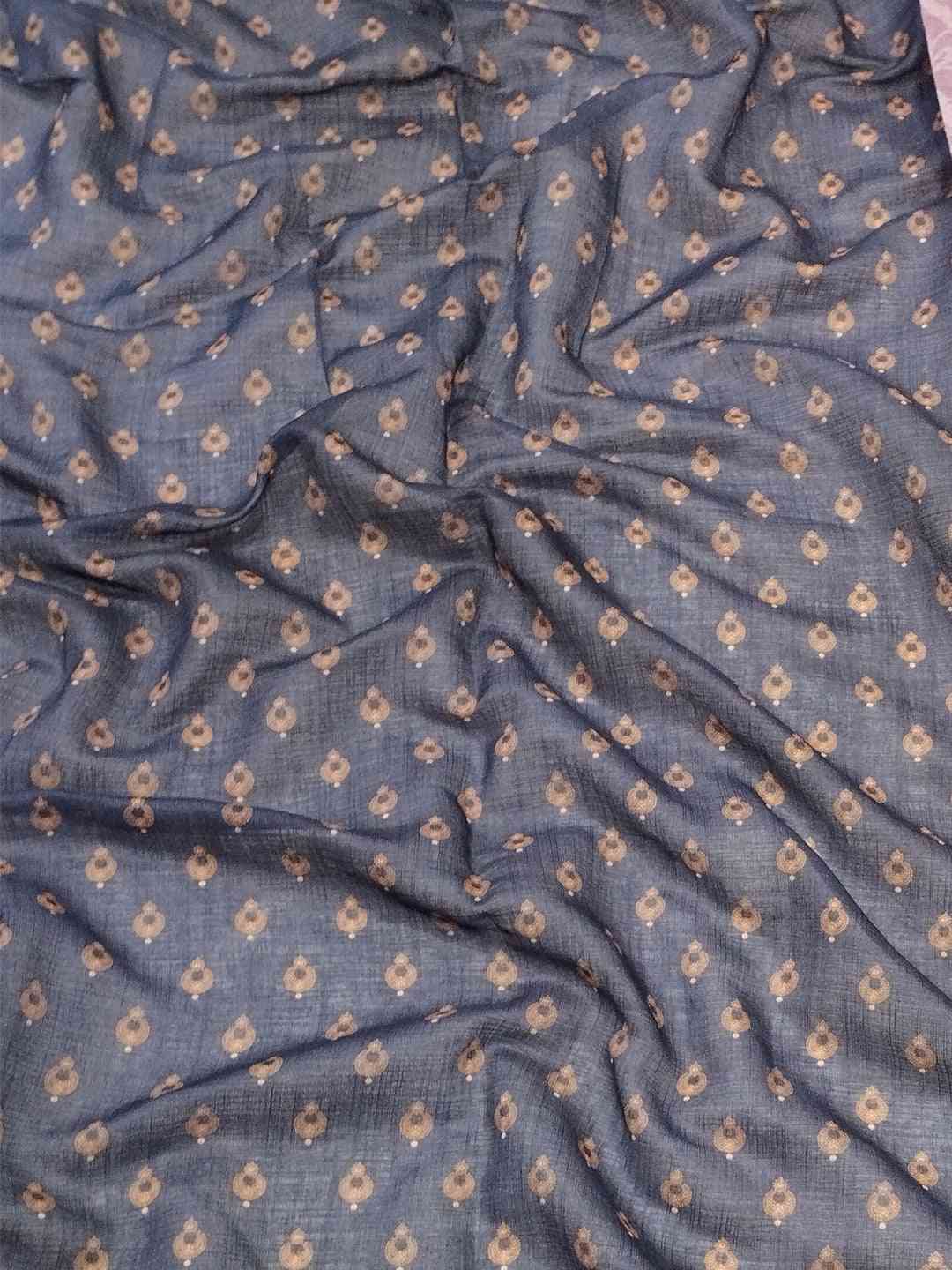 Close-up of fabric pattern on purple linen saree
