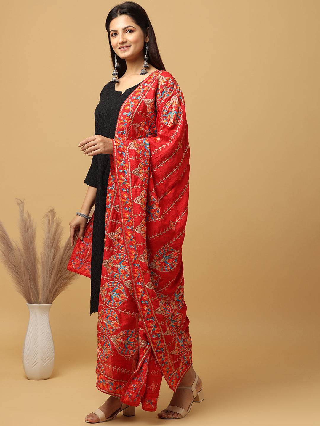 Side view of red chiffon dupatta with intricate threadwork