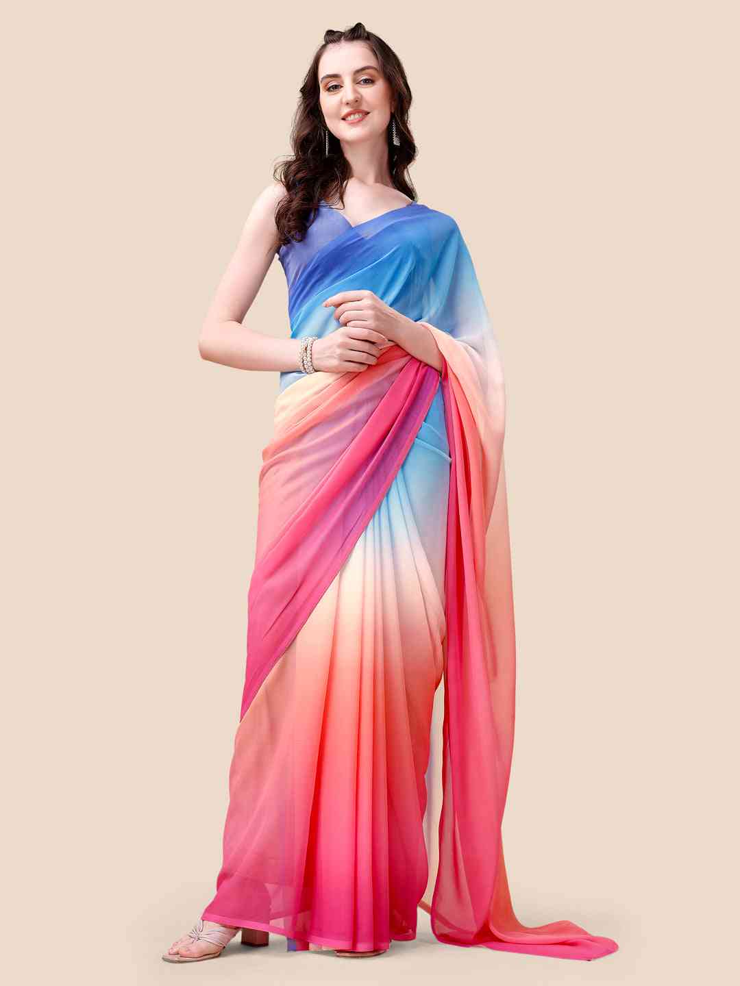 Model wearing Bollywood ombre saree in vibrant blue and pink hues.