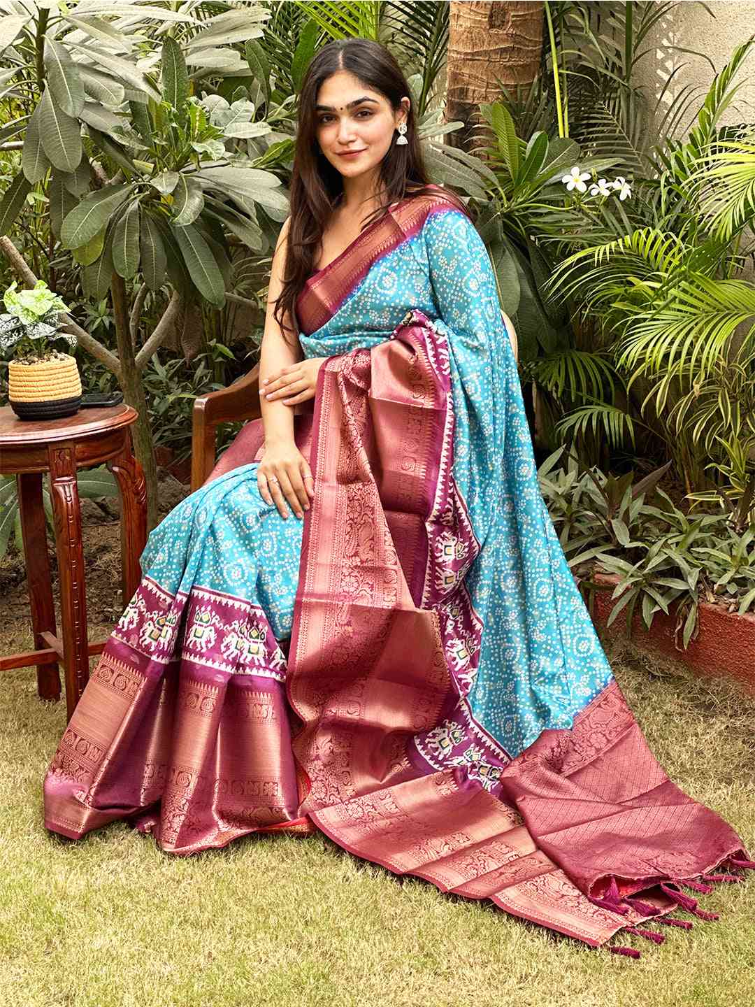 Turquoise silk Bandhej saree with intricate Pattu Zari border