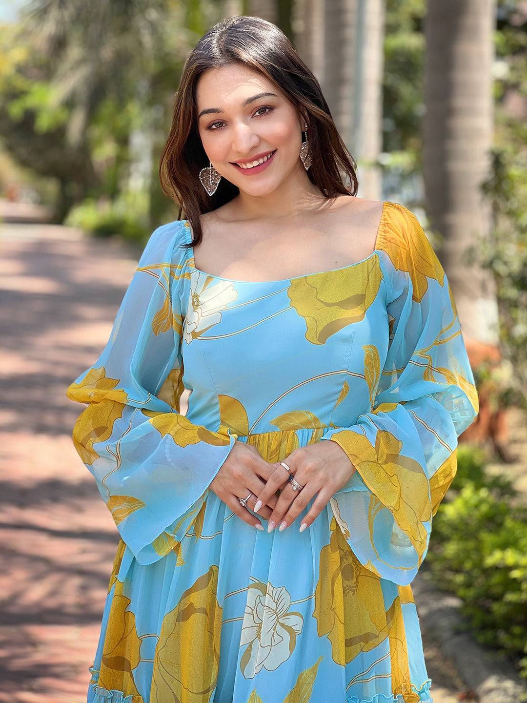 Close-up of Sky Blue Floral Dress with smiling model