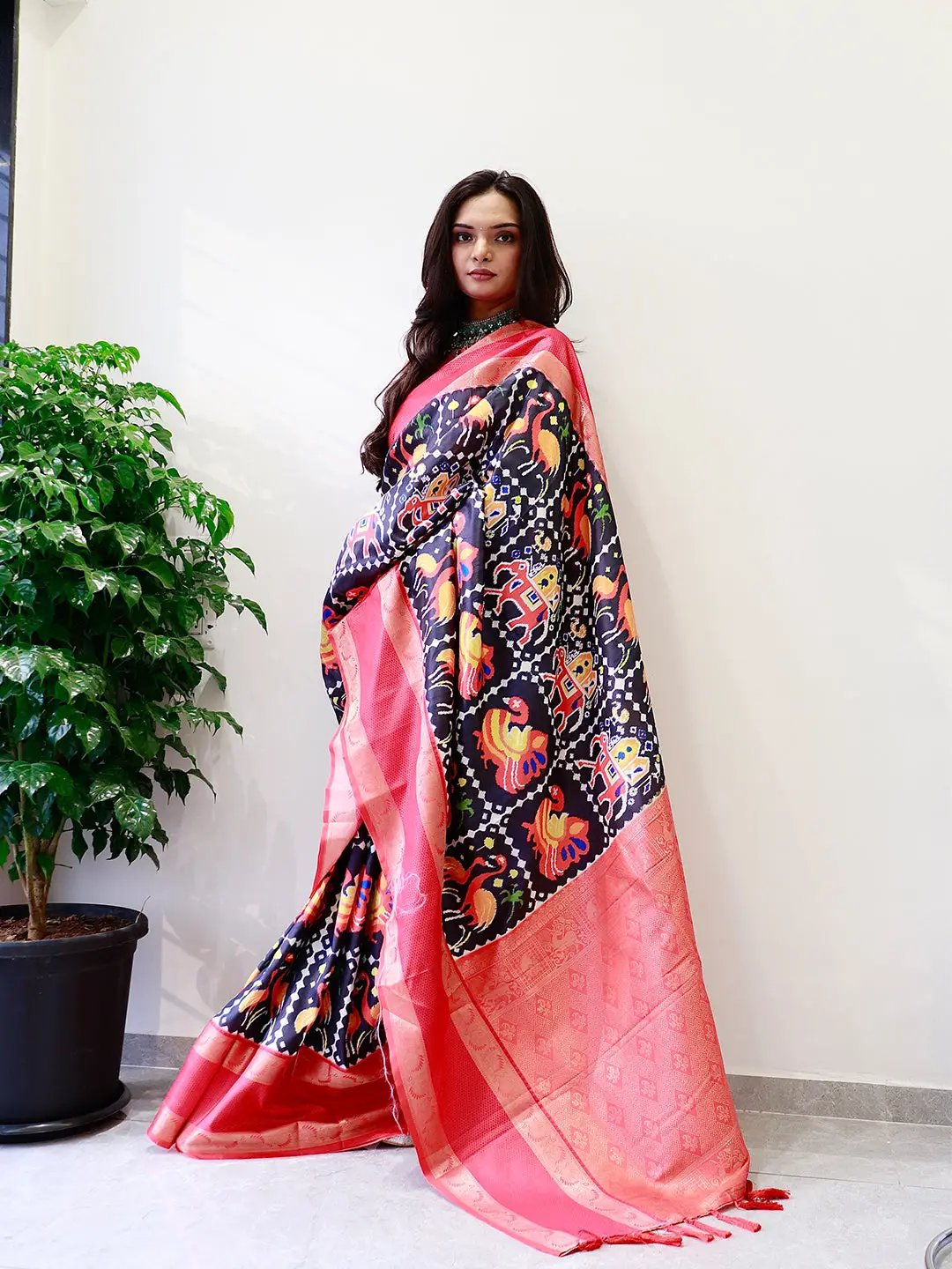 Stylish Pochampally print saree featuring a striking Gadwal border.
