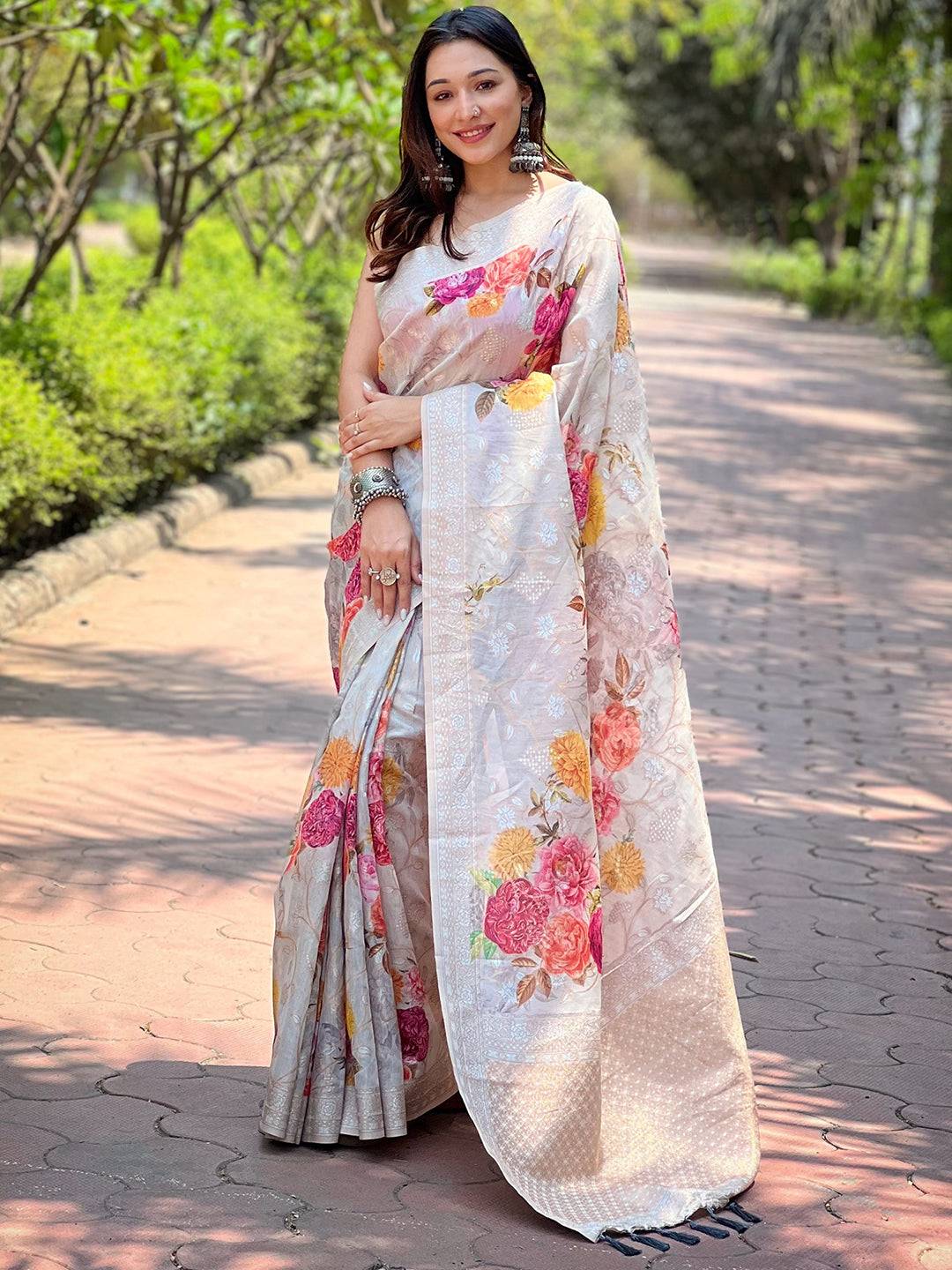 Model posing in grey Lakhnavi Bandla Zari saree with floral design