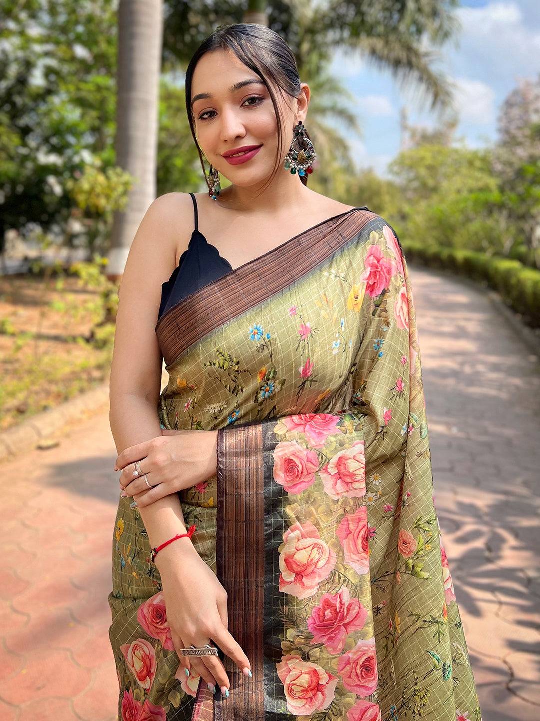 Close-up of pista silk saree with floral copper zari weaving