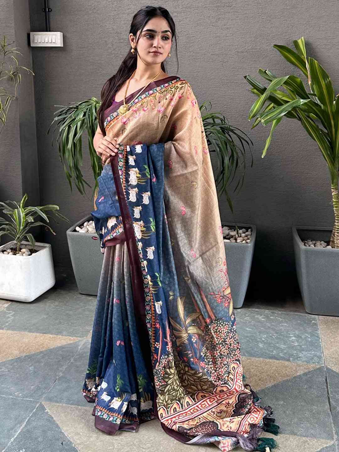 Traditional blue Pichwai saree with detailed patterns