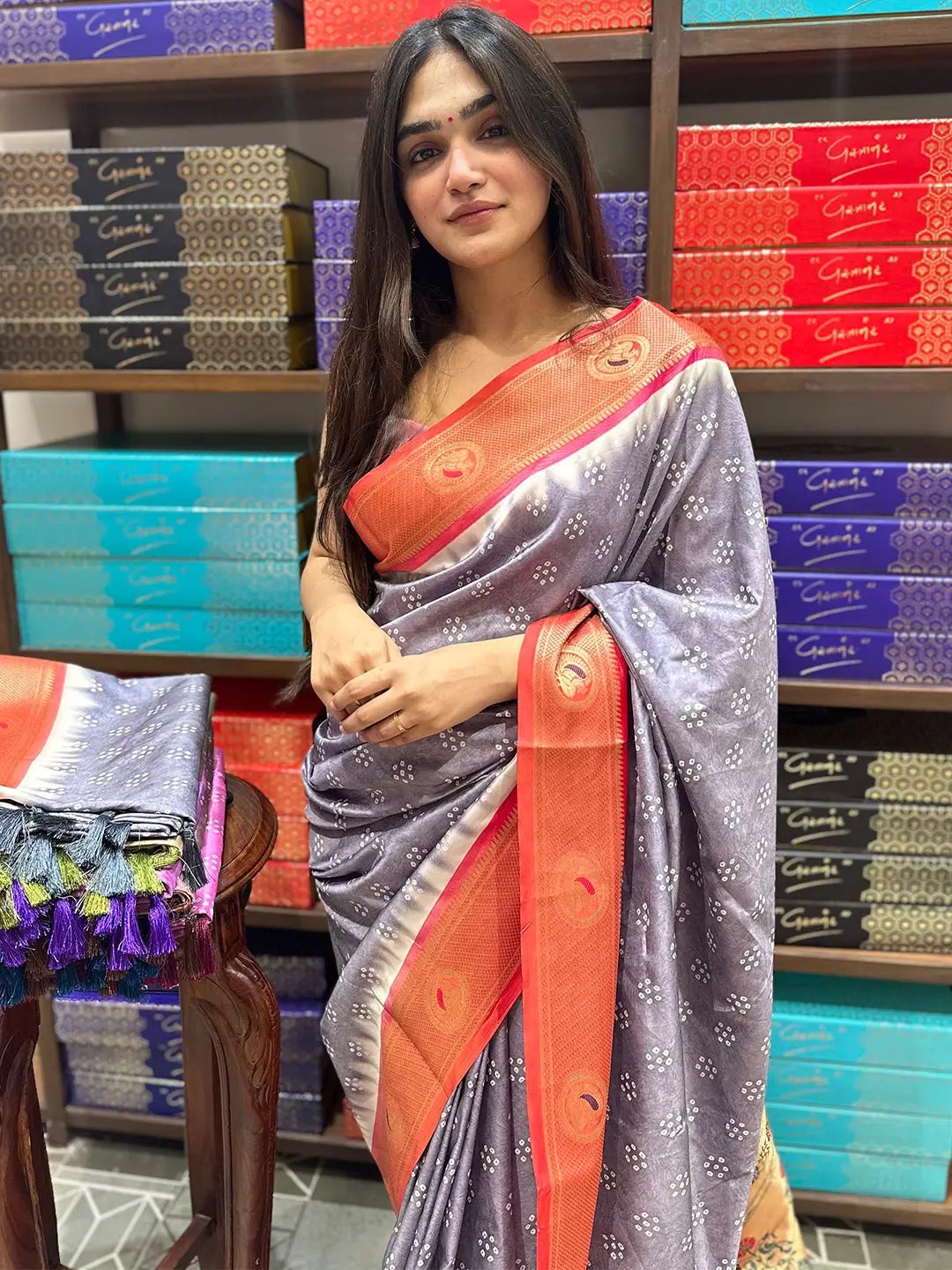 Model wearing Paithani Minakari Pallu Bandhej Print Saree indoors