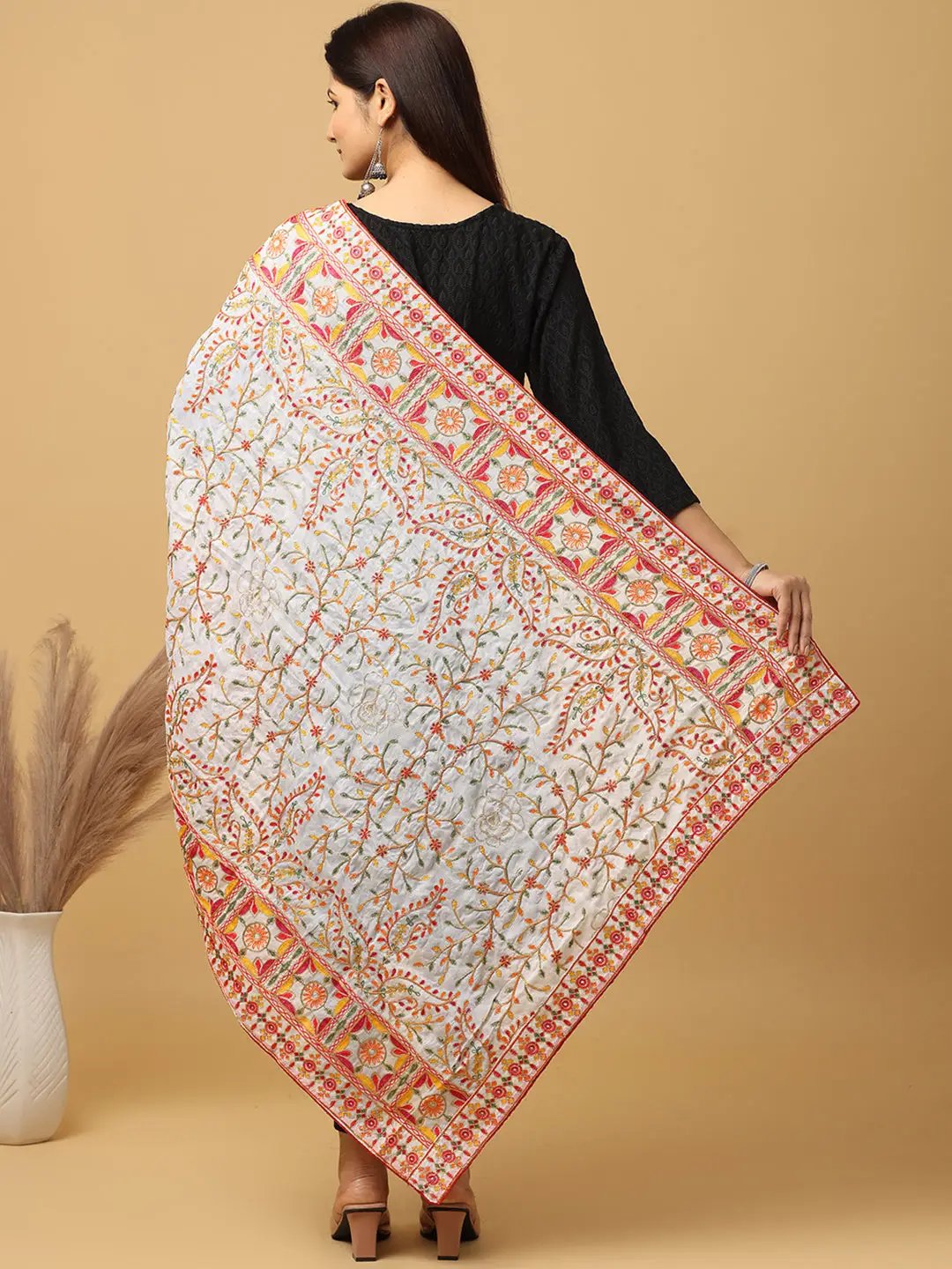 Back view of white dupatta showcasing intricate embroidery