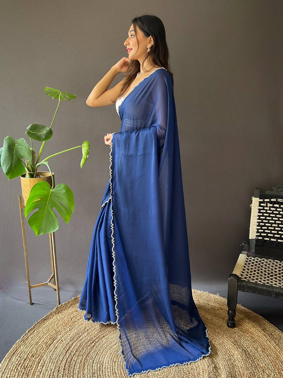 Side view of blue Rangoli silk saree with unique border design