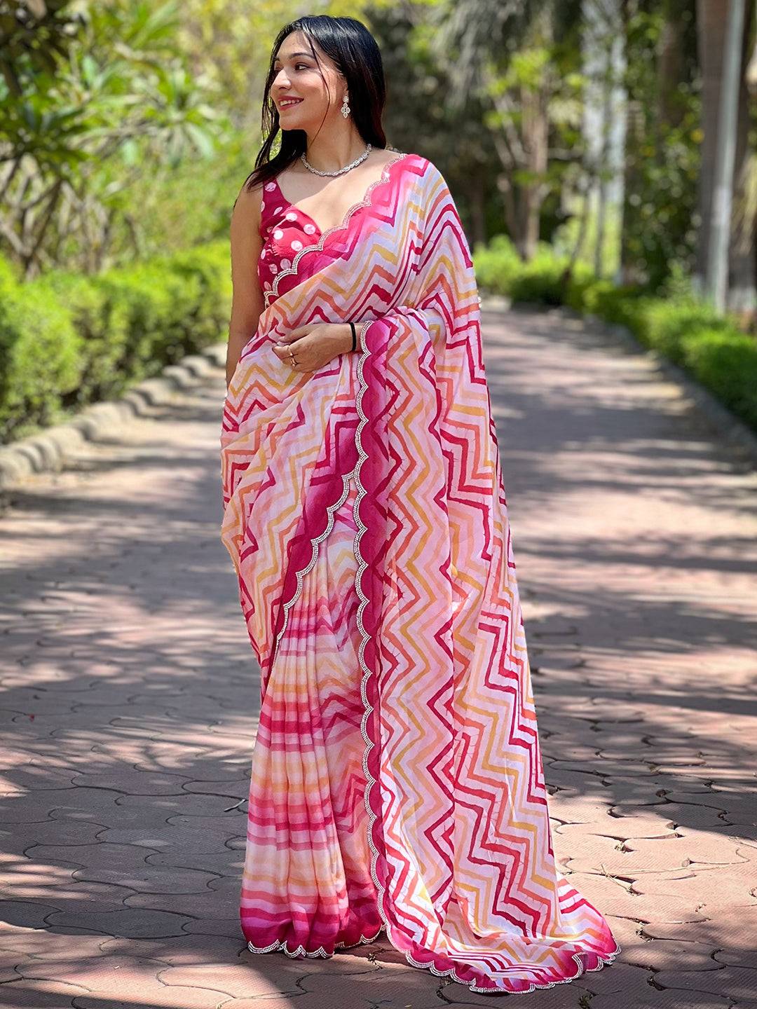 Woman wearing Leheriya and striped print saree, garden path