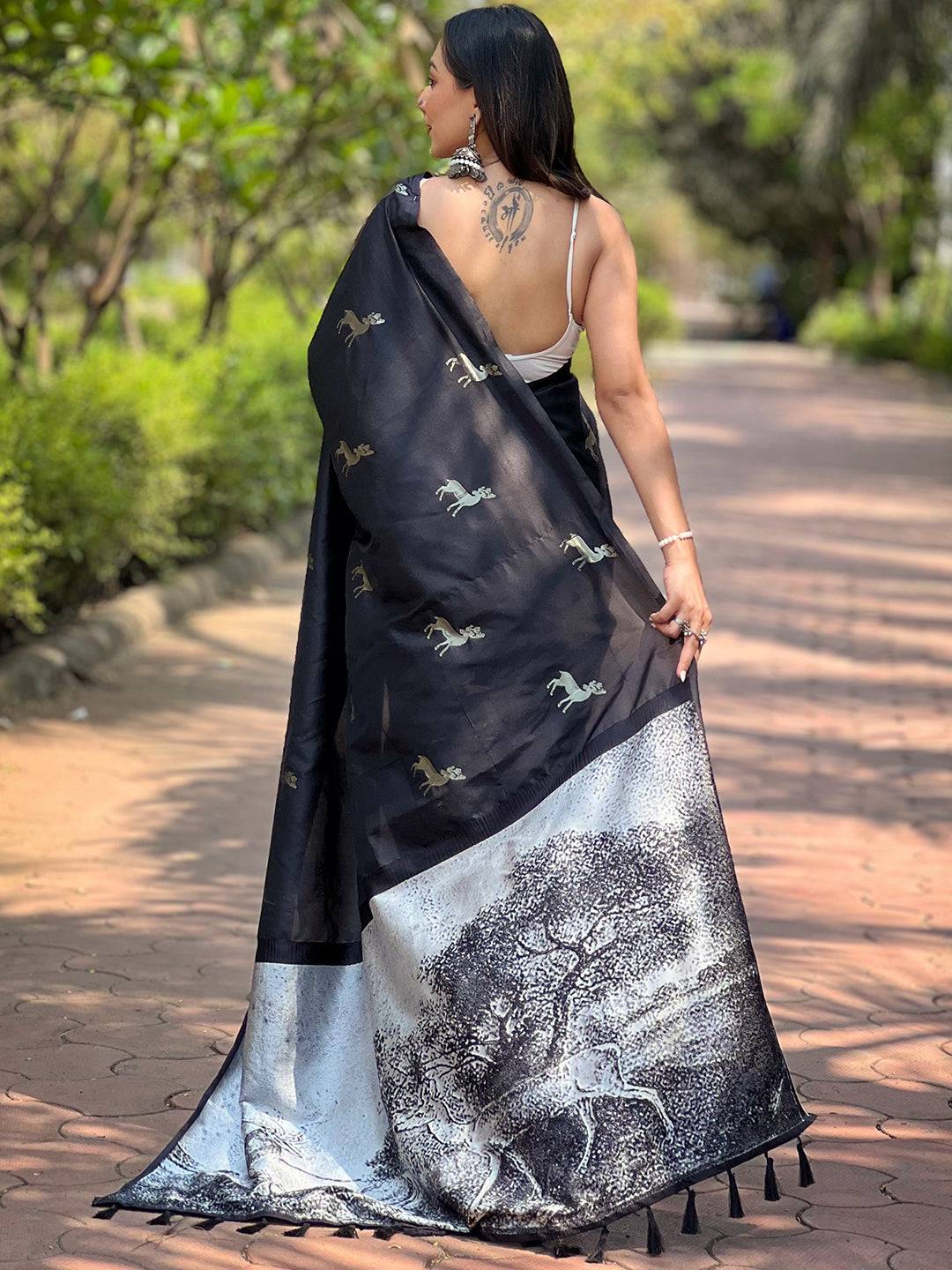 Back view of black soft silk saree with detailed zari pallu