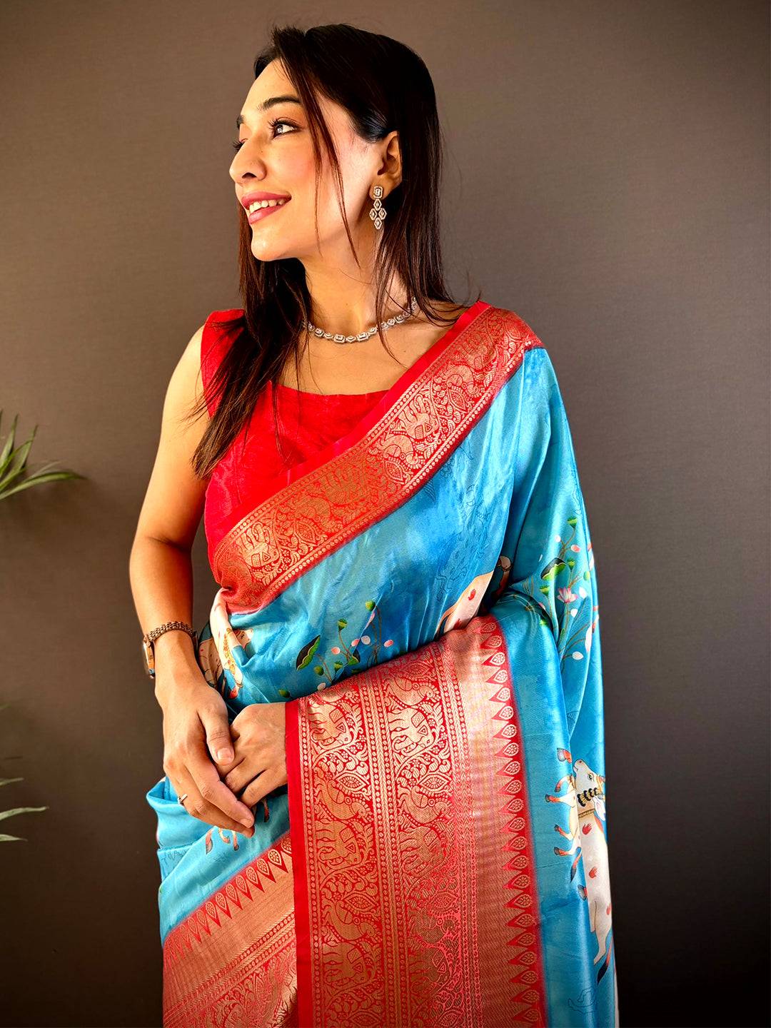 Blue soft silk saree with Pichwai Kalamkari print and gold zari border