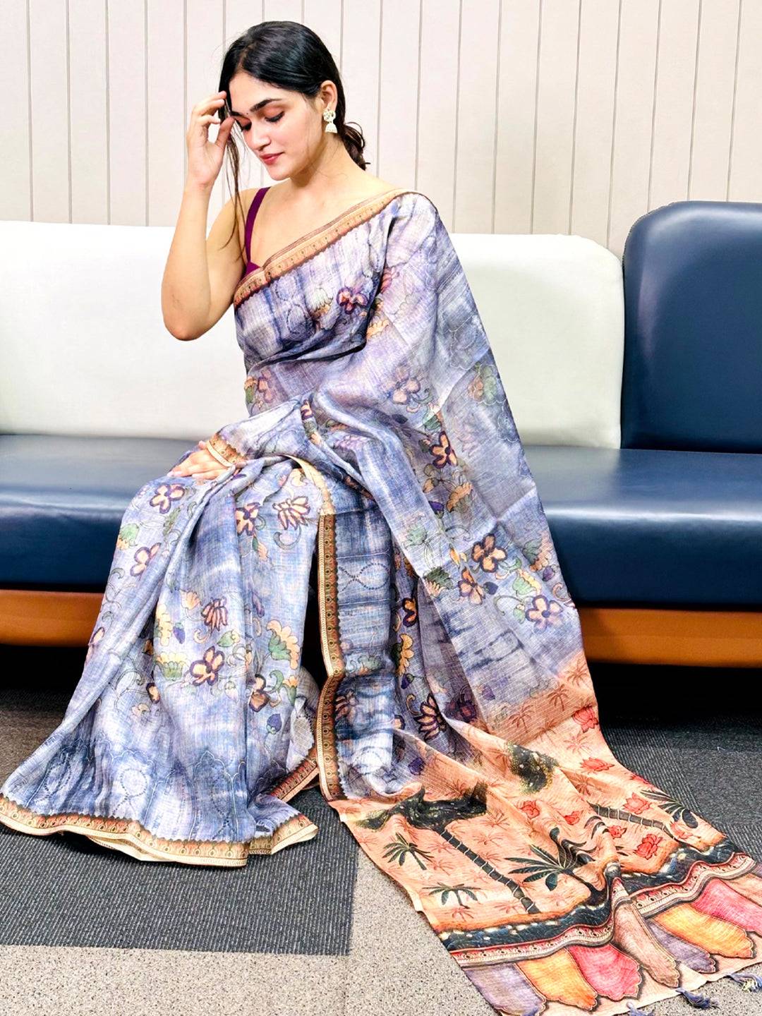 Elegant blue Kota Doriya silk saree with floral print on display.