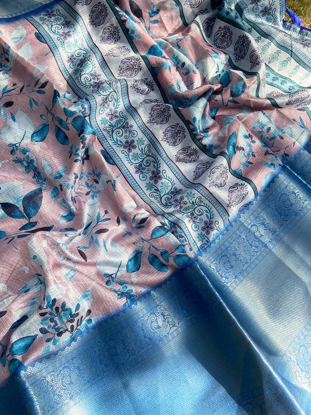 Muvel Kota Doriya saree spread out showing floral and paisley motifs