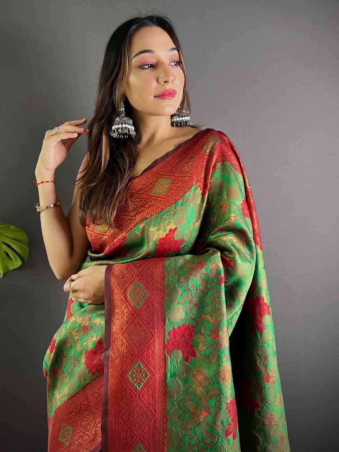 Model wearing Forest Green Soft Silk Butta Weaving Saree
