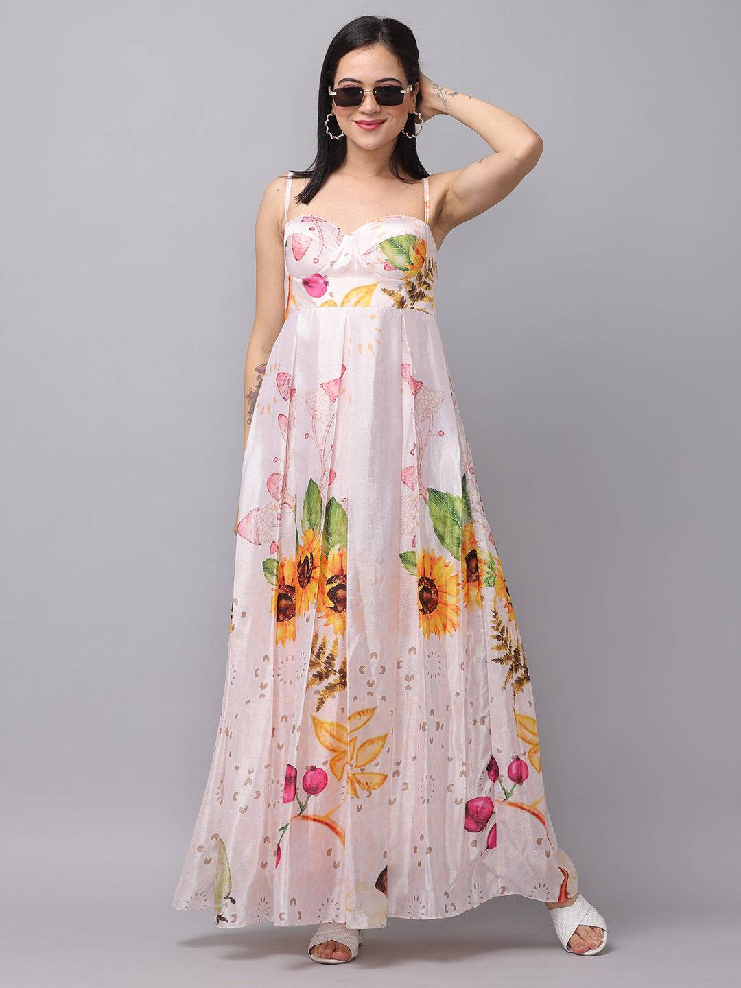 Model posing in floral chiffon dress, front view