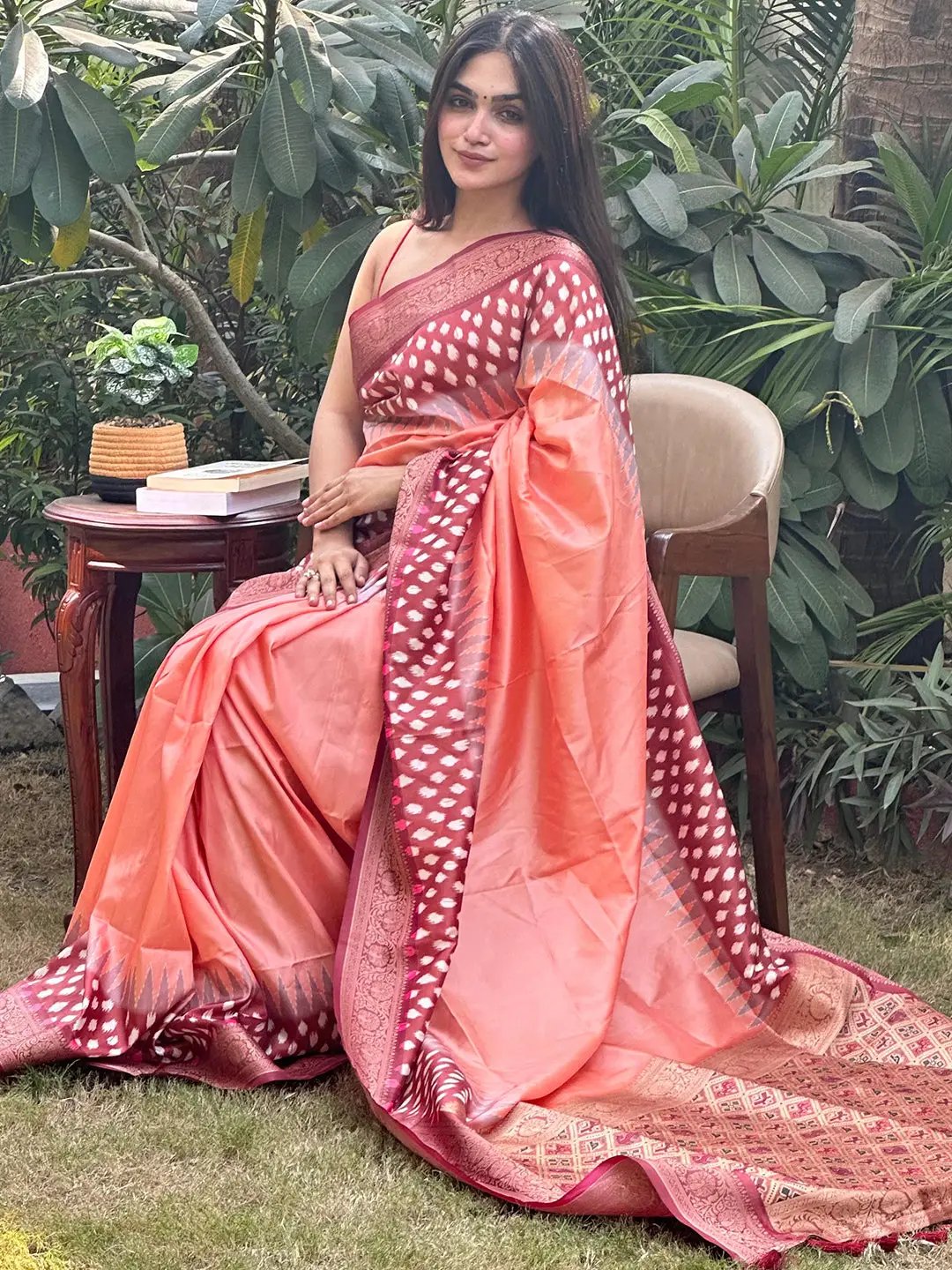 Peach Banarasi soft silk saree with Patola pallu, garden setting