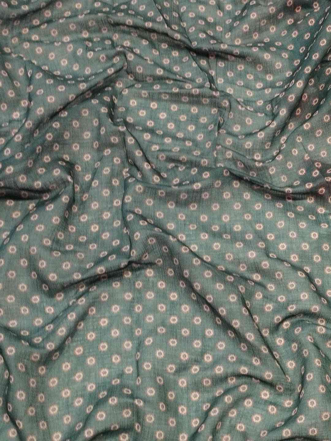 Close-up of Gajari Ikkat saree fabric with pattern
