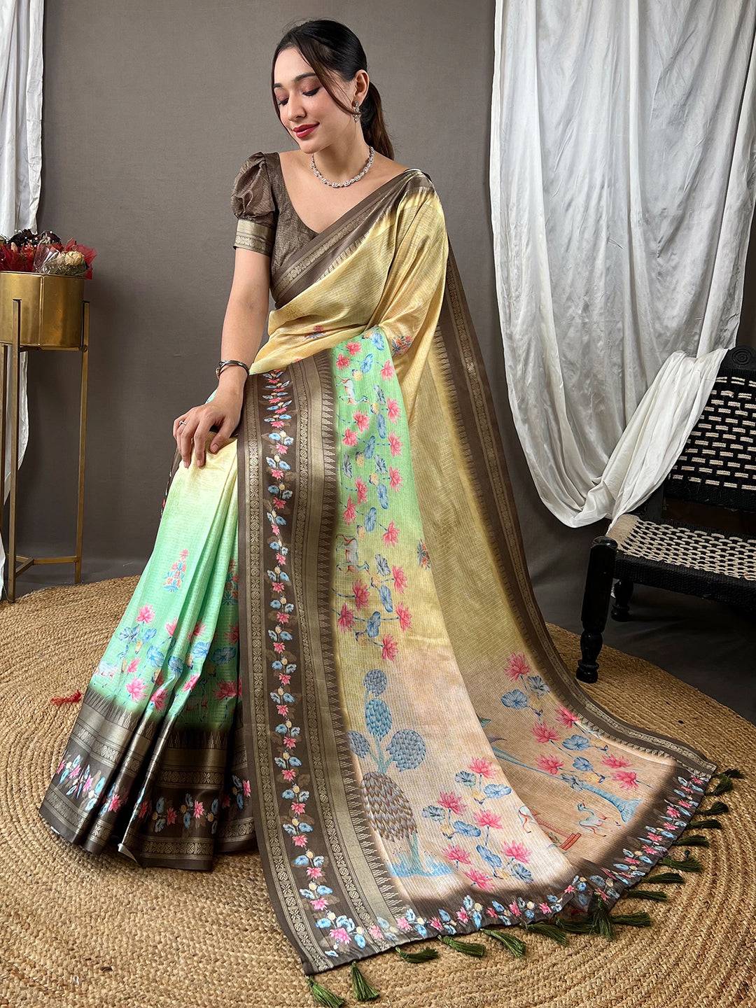 Beige Kota saree with satin border, adorned with floral motifs.