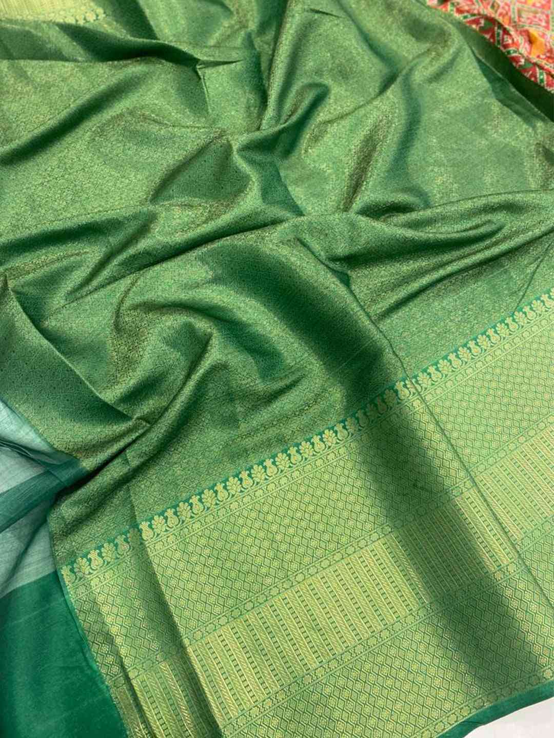 Close-up of green Moonga silk saree fabric