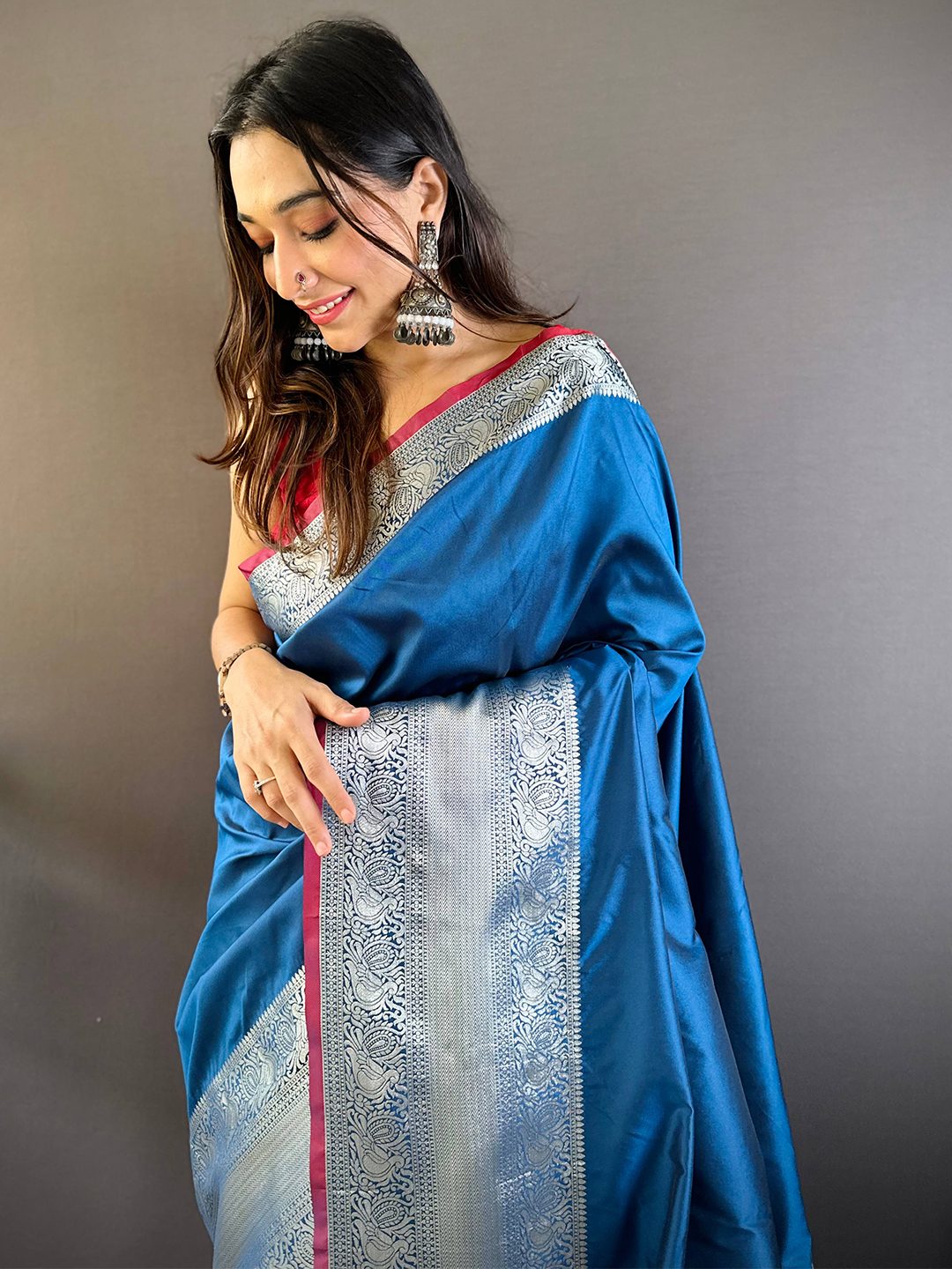 Teal soft silk Kanchi zari saree, close front drape on a model with silver woven zari border