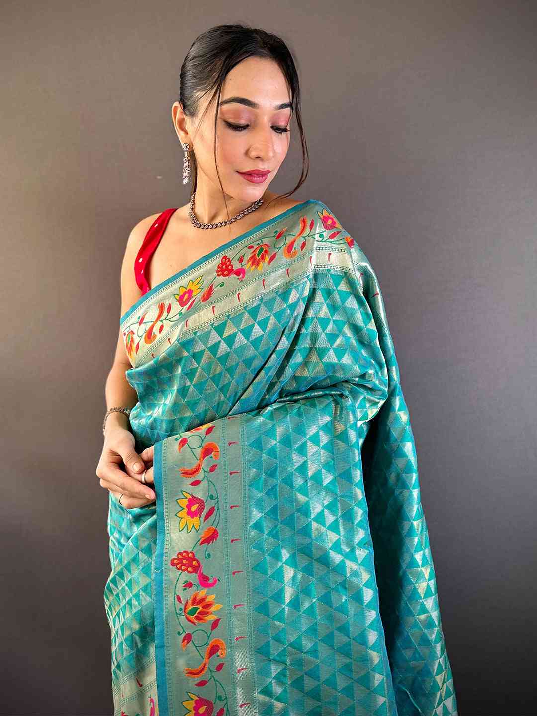 Rama silk blend Paithani saree with woven zari work