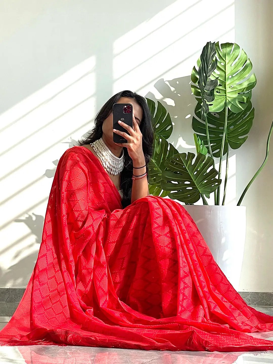 Red georgette saree with elegant thread weaving design