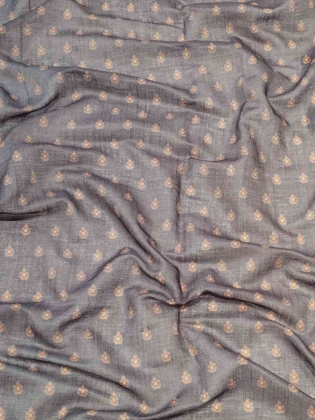 Close-up of grey linen saree fabric with digital print