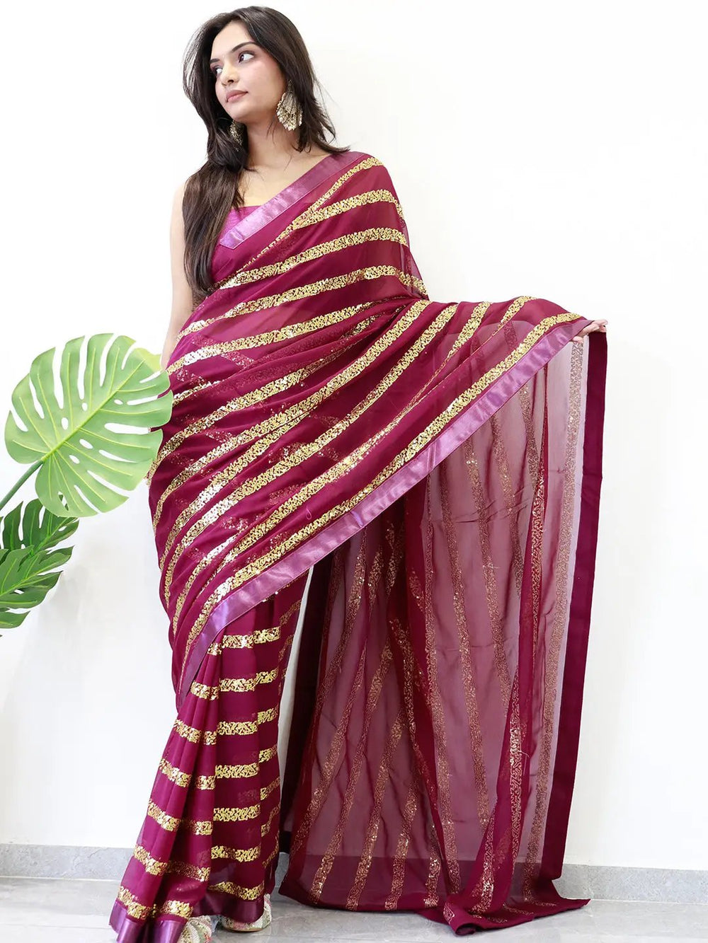 Front view of georgette saree with solid border and sequins