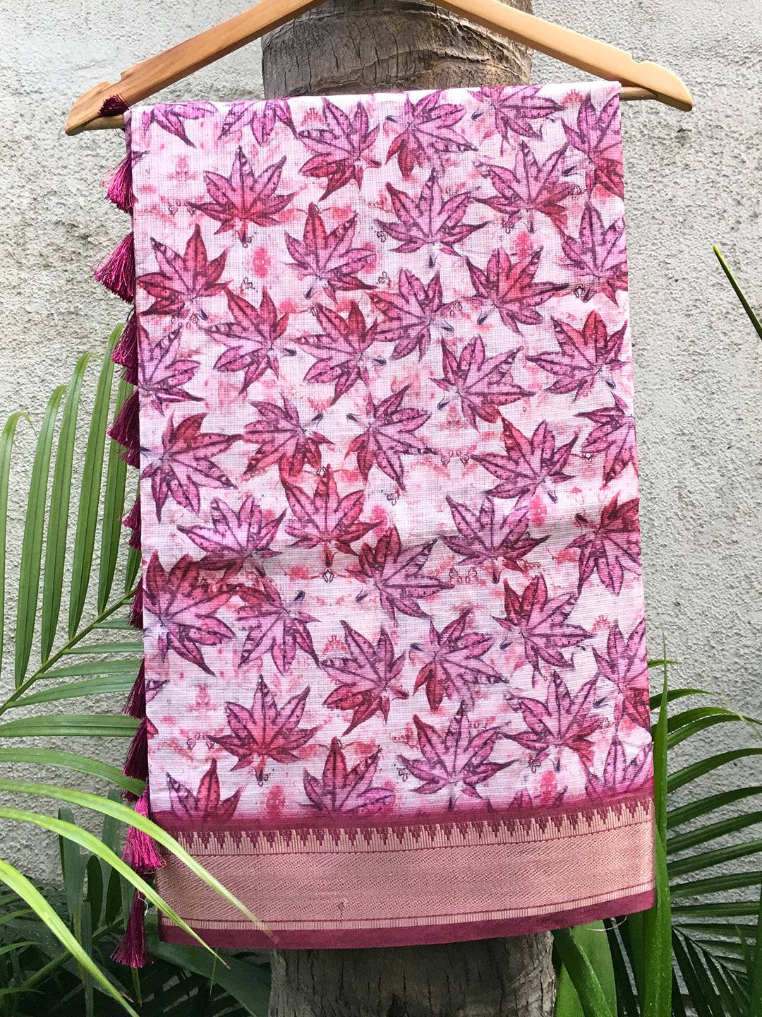 Kanjivaram light pink saree with gold zari pattu border and leaf print