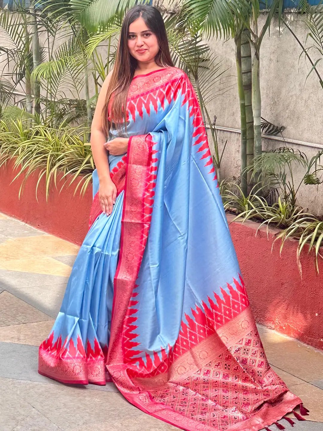 Stylish Banarasi silk saree in blue with intricate red border