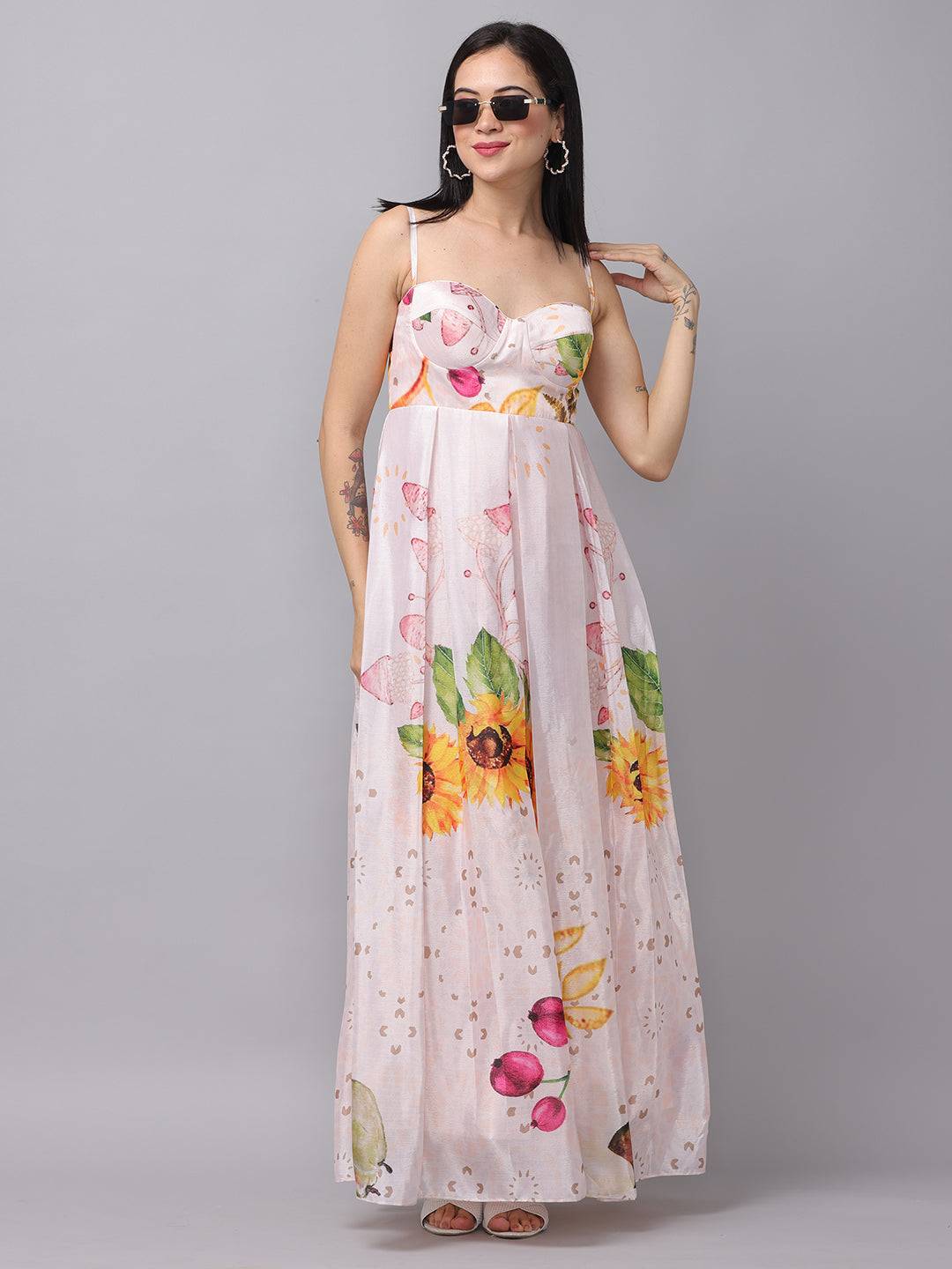 Model in floral chiffon dress with sunglasses, hand on hip